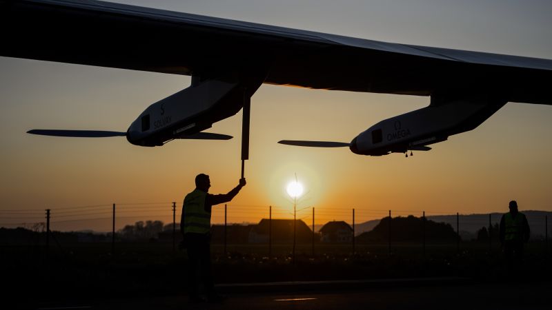 NextImg:Meet the pilots behind the sun-powered plane that can 'fly forever' | CNN Business