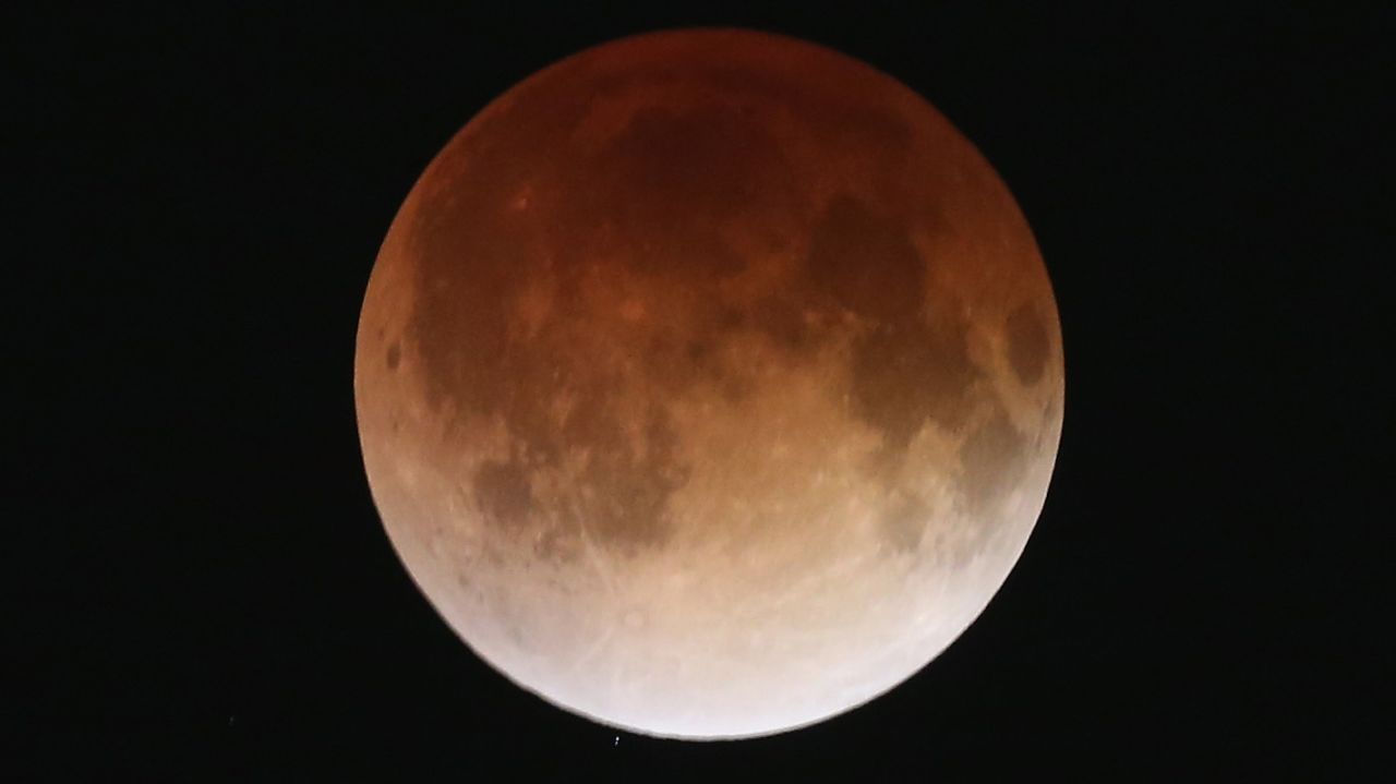 The total lunar eclipse is seen in this image taken from Miami. Unlike solar eclipses, lunar eclipses are safe to view with the naked eye and don't require special filters.