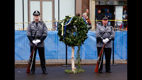 A wreath was laid at one of the bomb sites, under a steady rain on Boston's Boylston Street.
