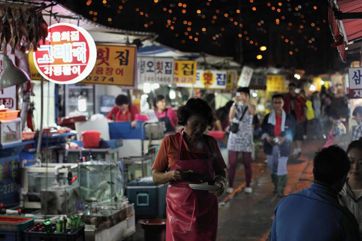 <strong>Jagalchi Market </strong><br /><br />Tracing its roots to 1889, Korea's largest seafood market is one of Busan's must-visit sights. It's open well into the night. <br /><br />With 480 shops, the market -- shot here by Indy Randhawa -- hosts many festivals throughout the year. Visitors can pick out fresh seafood and have it prepared by vendors to eat on the spot.<br /><br /><a href="http://travel.cnn.com/seoul/eat/food-map-search-koreas-best-regional-cuisine-391772" target="_blank">READ: Food map: Eat your way around Korea</a>