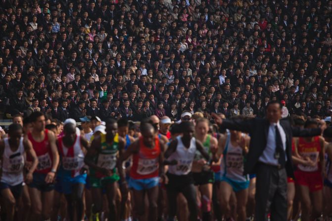 Spectators watch from the stands of Pyongyang's Kim Il Sung Stadium on April 13 as runners line up at the start of the North Korean capital's annual marathon.
