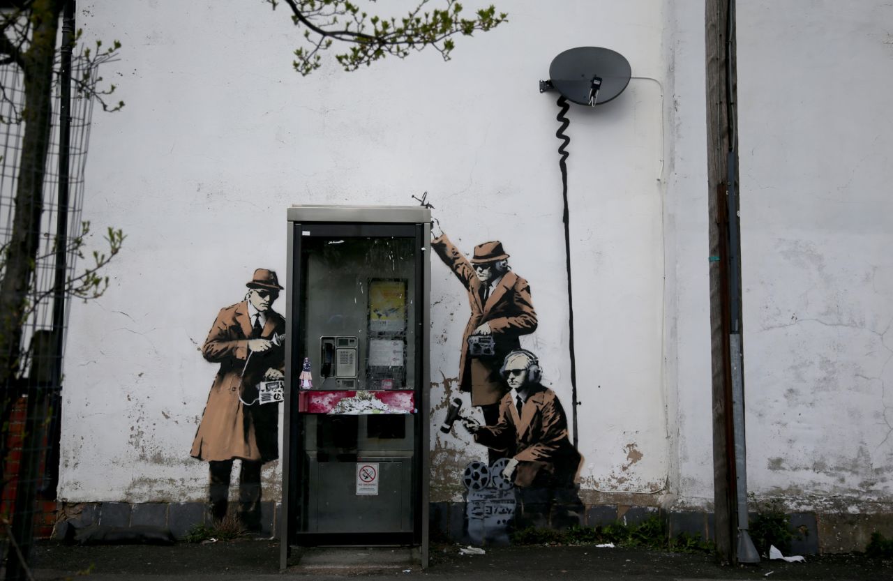 Banksy's work often plays with overtly political themes such as surveillance culture and state corruption. 