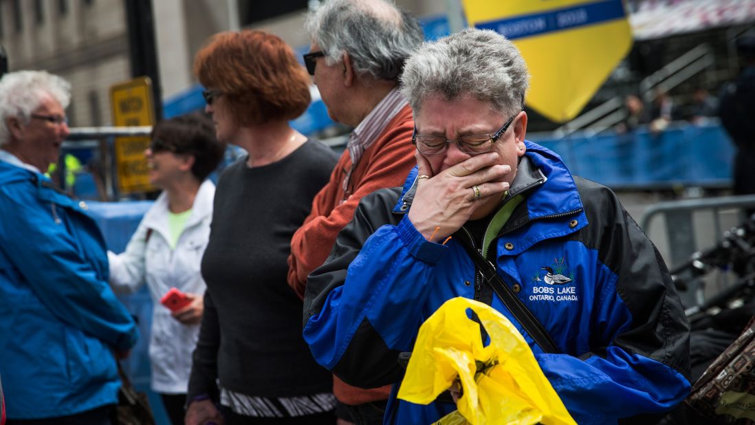 Sharon Neary, of Rochester, New York, cries while watching Tuesday's ceremony in Boston.