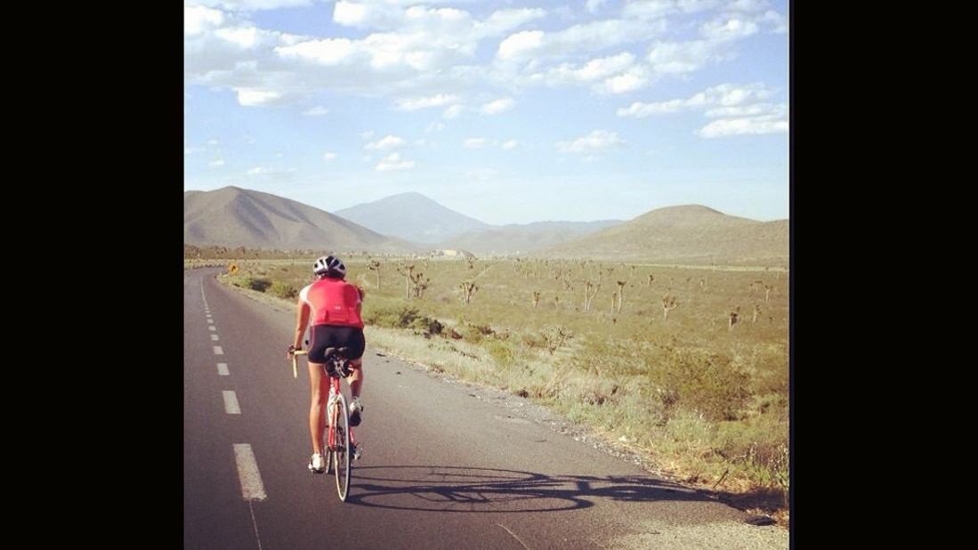 After finishing her swim, Bastidas jumped on her bike to travel more than 2,900 miles from Cancun to Atlanta. "You're only as strong as your greatest accomplishment," she says. 