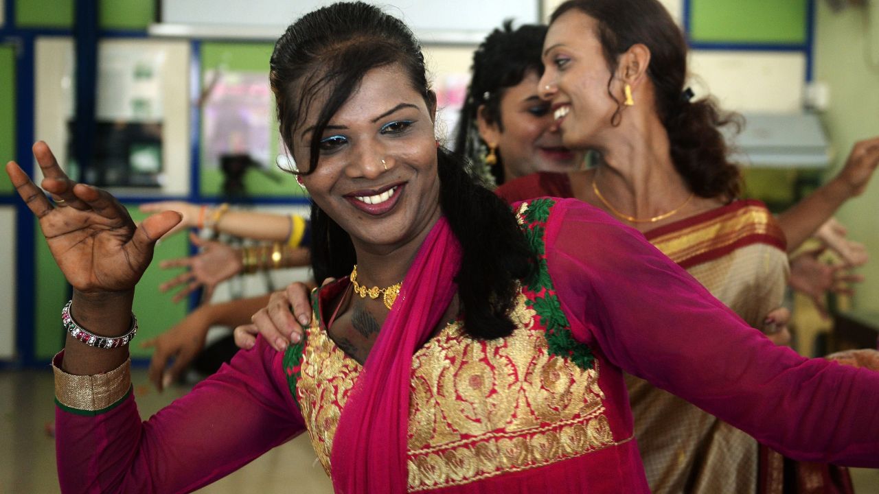 An Indian transgender resident dances with others at an event to celebrate a Supreme Court judgement in Mumbai on April 15, 2014. India's highest court ruled that a person can be legally recognised as gender-neutral, a landmark judgement that raises hopes of an end to discrimination against several million transgenders and eunuchs.