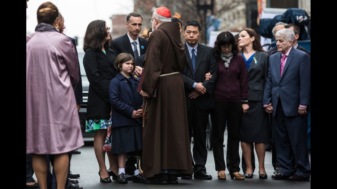 The family of Martin Richard, an 8-year-old boy killed in the attack, meet with Cardinal Sean Patrick O'Malley during the wreath-laying ceremony. Martin was one of three people killed in the bombings. At least 264 people were injured.