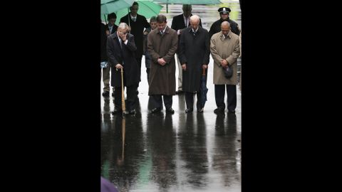 From left, former Boston Mayor Tom Menino, Boston Mayor Martin Walsh, Vice President Joe Biden and Massachusetts Gov. Deval Patrick lower their heads for a moment of silence during the tribute. "America will never, ever, ever stand down," Biden said during the ceremony. "We are Boston. We are America. We respond, we endure, we overcome and we own the finish line."