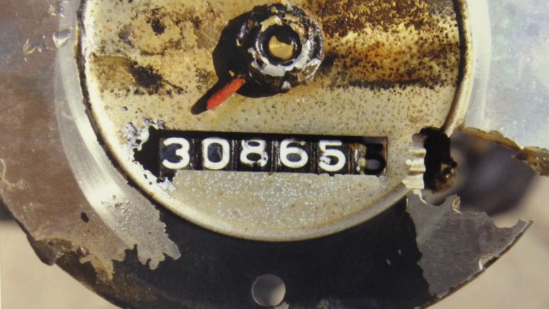 The 1960 Studebaker's ignition and headlights were turned on, and the transmission was in third gear, the attorney general said. The odometer mileage reading is seen here.
