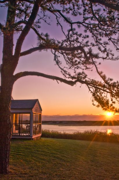 The 12-acre Dunes on the Waterfront, in Ogunquit, Maine, has 17 rooms, each with a pair of Adirondack chairs, as well as 19 cottages with their own screened-in porches. The beach is just across the river.