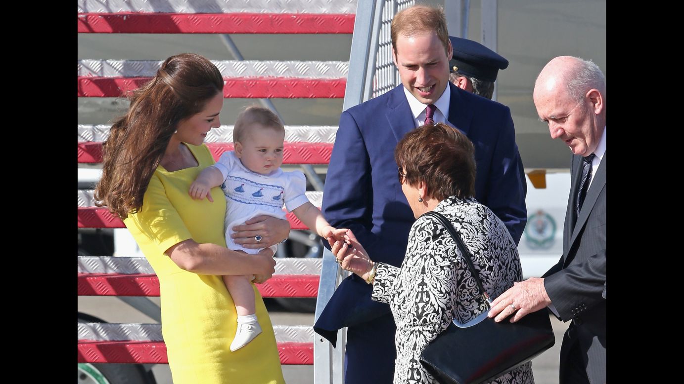Lynne Cosgrove, wife of Australia's governor-general, greets Britain's royal couple and Prince George at Sydney Airport on April 16.