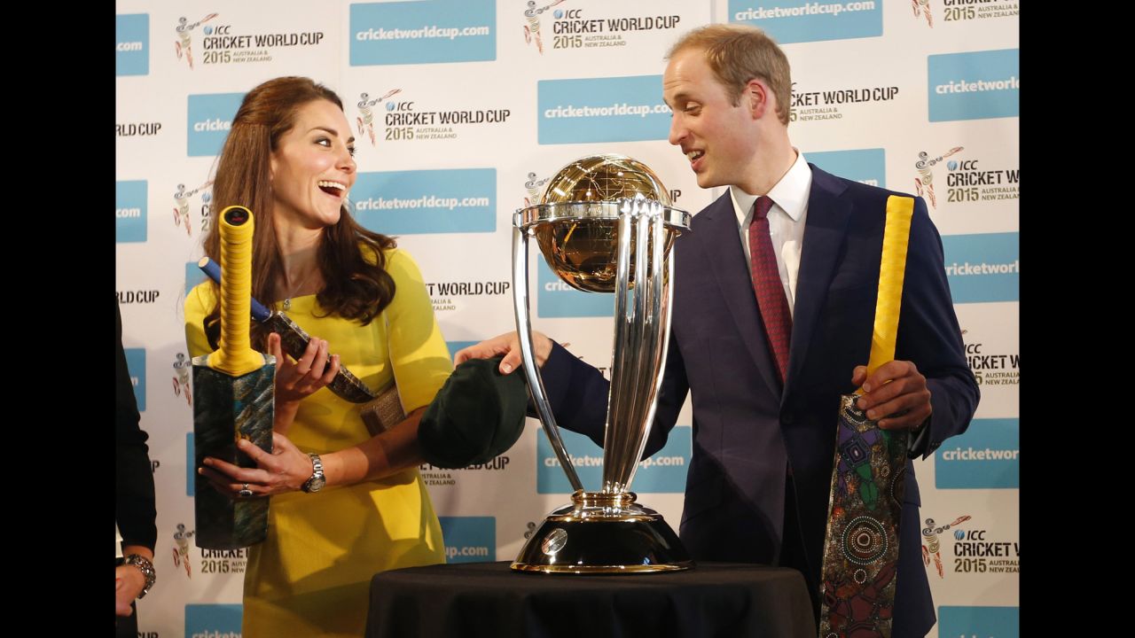 The royal couple receive cricket bats in front of the Cricket World Cup trophy at an April 16 reception at the Sydney Opera House.