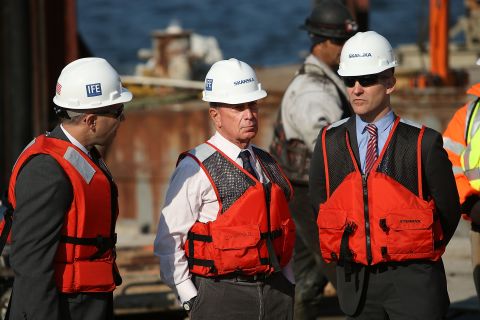 In October, on the one-year anniversary of Hurricane Sandy, Bloomberg, center, stands on a rig installing a new sea wall in the Rockaways.