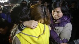 Relatives weep as they wait for missing passengers of a sunken ferry at Jindo port on April 16, 2014 in Jindo-gun, South Korea.