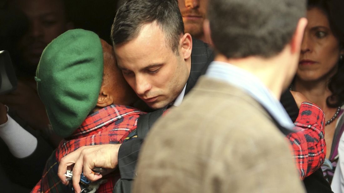 Pistorius gets a hug from a woman as he leaves court in Pretoria on Wednesday, April 16.