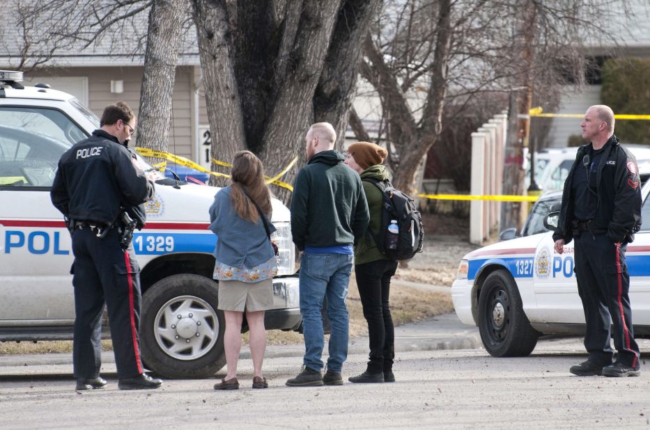 Calgary police talk to potential witnesses for statements.