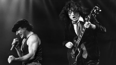 Brian Johnson and Angus Young perform in Leiden, Netherlands, in 1991. Johnson took over as lead singer and sang on AC/DC's biggest hits, including "Back in Black" and "You Shook Me All Night Long."