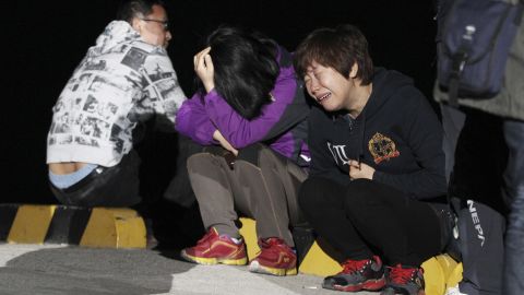 A relative of a passenger cries as she waits for news on Wednesday, April 16.