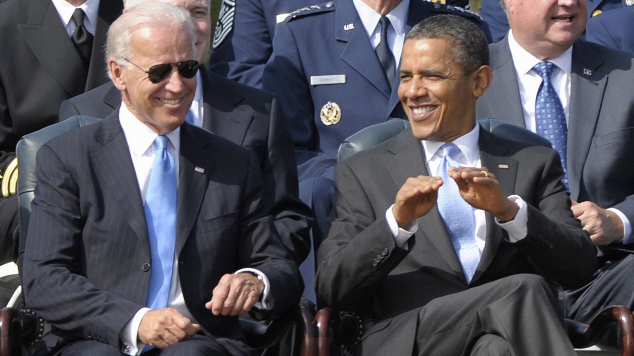 Biden sits with Obama during a ceremony in Arlington, Virginia, in September 2011.