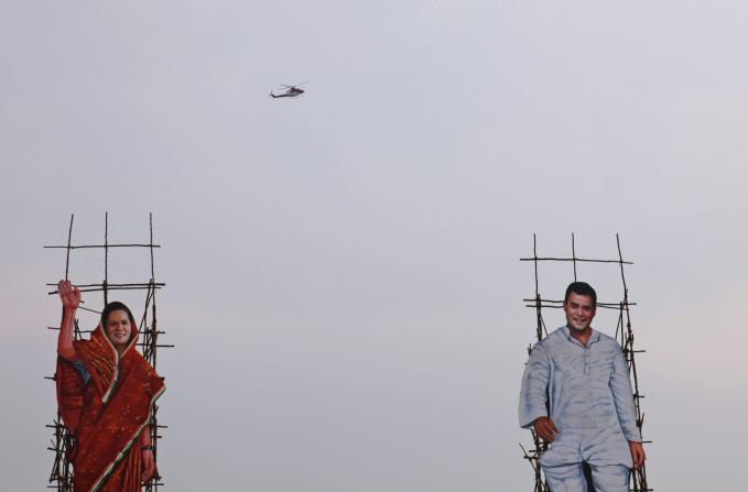 Portraits of Congress Party President Sonia Gandhi, left, and Vice President Rahul Gandhi are seen at an election rally in Karimnagar, India, on April 16.