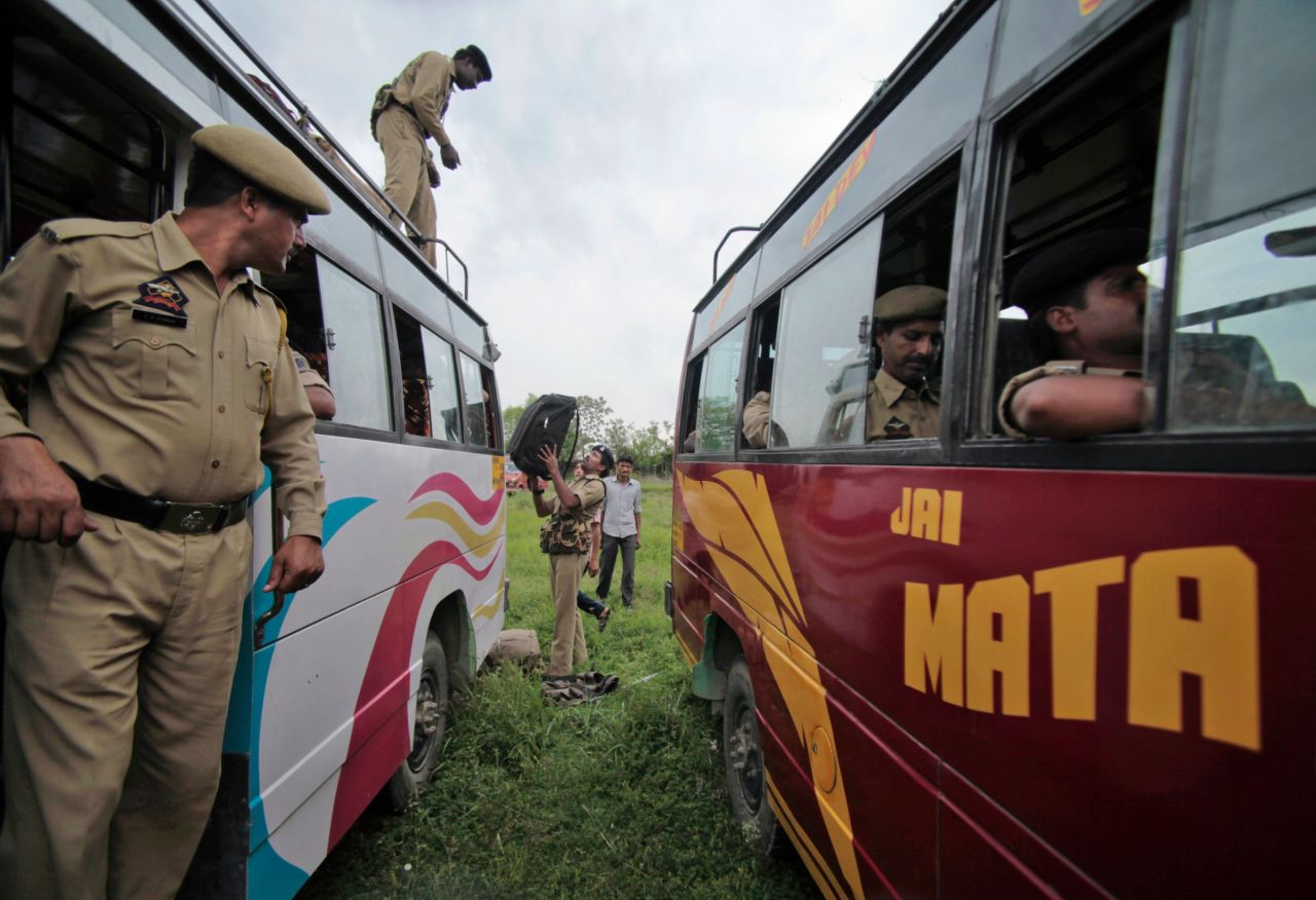 Security personnel load their luggage on a bus as they leave for various polling centers in Udhampur, India, on Tuesday, April 15.
