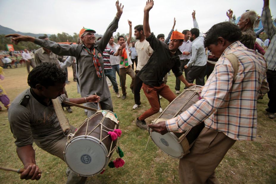 Supporters of India's main opposition Bharatiya Janata Party dance during a campaign rally in Udhampur on April 15.