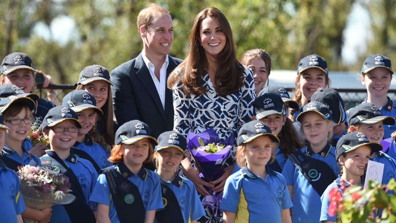 The duke and duchess join Girl Guides after planting a tree Thursday, April 17, in Winmalee, Australia, an area heavily affected by recent bush fires.