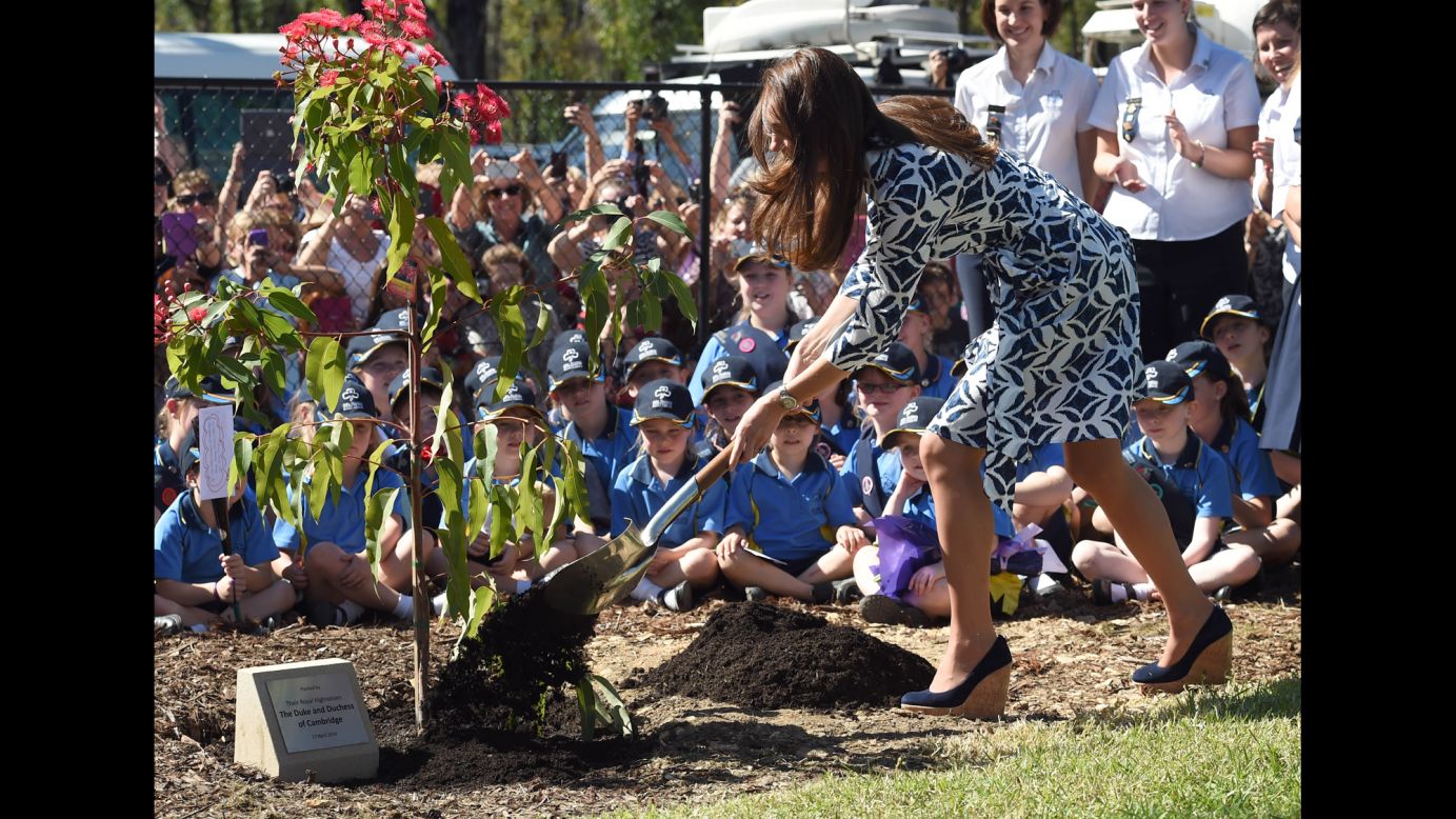 Catherine shovels dirt at the tree planting in Winmalee on April 17.