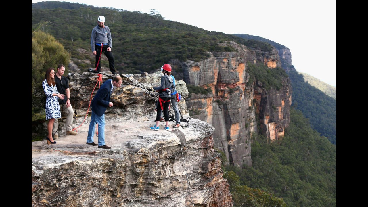 William peers over a cliff edge at Narrow Neck Lookout near Katoomba, Australia, as he and his wife observe team-building exercises by a youth group on April 17.