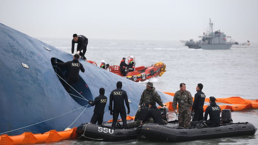 South Korean rescue team members search for passengers aboard a ferry sinking off South Korea's southern coast, in the water off the southern coast near Jindo, south of Seoul, South Korea, Thursday, April 17, 2014. Fears rose Thursday for the fate of more than 280 passengers still missing more than 24 hours after their ferry flipped onto its side and filled with water off the southern coast of South Korea. (AP Photo/Yonhap) KOREA OUT