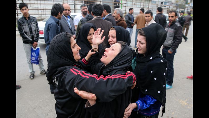 Balal's family embraces after the execution was halted.