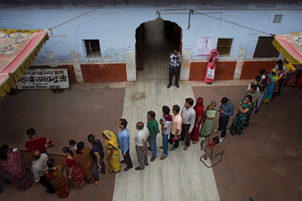 People stand in line to cast their votes in Jaipur on April 17.