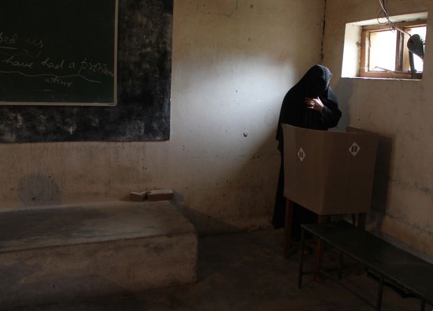 A voter casts her ballot at a polling booth in Doda, India, on April 17.