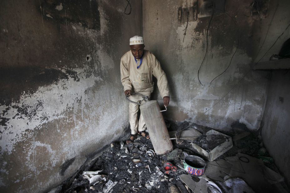 An official displays burned equipment inside a prison in Bauchi, Nigeria, on September 9, 2010, after the prison was attacked by suspected members of Boko Haram two days earlier. About <a href="http://www.cnn.com/2010/WORLD/africa/09/08/nigeria.prison.break/index.html">720 inmates escaped</a> during the prison break, and police suspect the prison was attacked because it was holding 80 members of the sect.