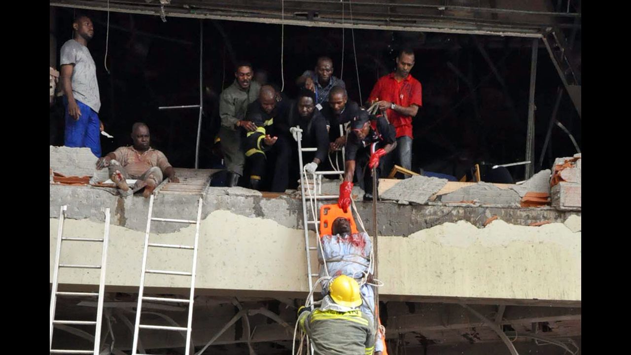 Rescue workers help a wounded person from a U.N. building in Abuja, Nigeria, on August 26, 2011. The building was rocked by a bomb that killed at least 23 people, leaving others trapped and causing heavy damage. Boko Haram had claimed responsibility for the attack in which a Honda packed with explosives <a href="http://www.cnn.com/2011/WORLD/africa/08/31/nigeria.attack.al.qaeda/index.html">rammed into the U.N. building</a>, shattering windows and setting the place afire. 