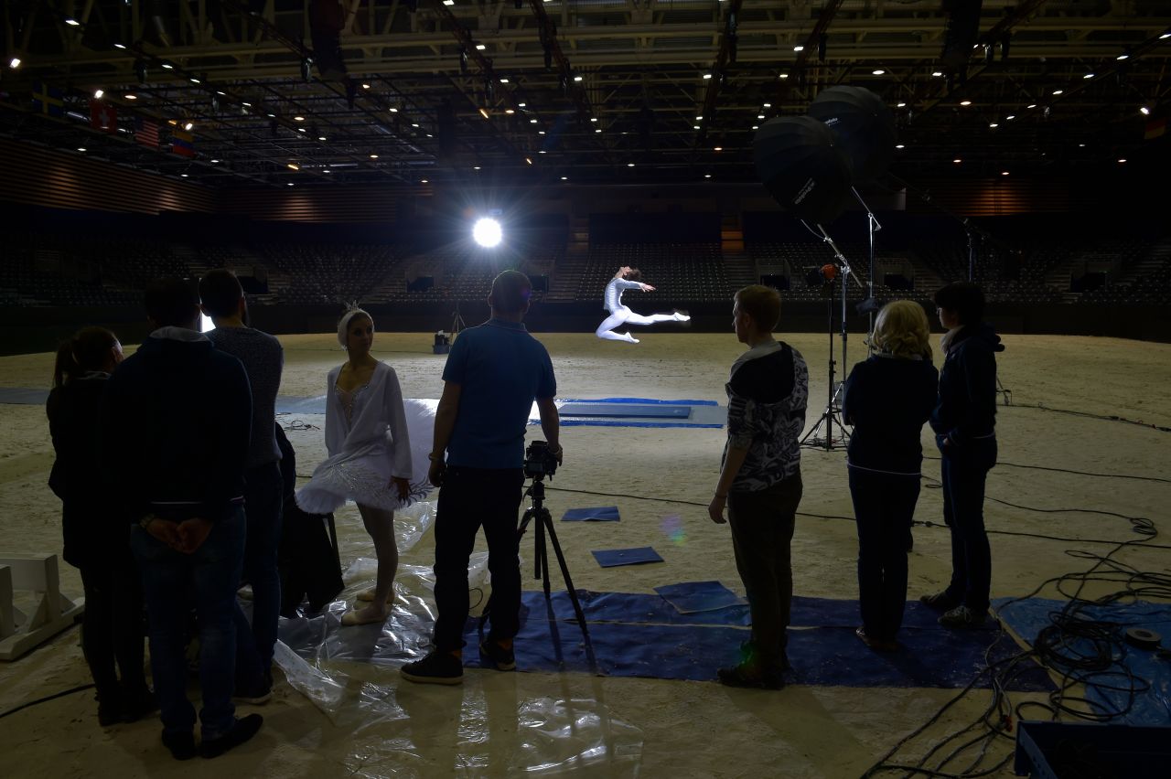 The dancers met the riders in the arena, before welcoming them to a performance of their own -- dancing Swan Lake at the Lyon Amphitheatre as part of a nationwide French tour.