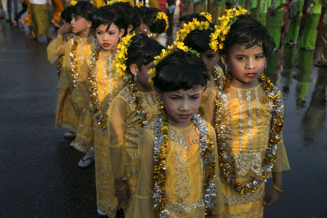  APRIL 17 - YANGON, MYANMAR: Young Burmese dancers wearing traditional clothing wait to take part in the closing ceremony on the fourth day of the Burmese new year water-throwing festival called Thingyan on April 16.