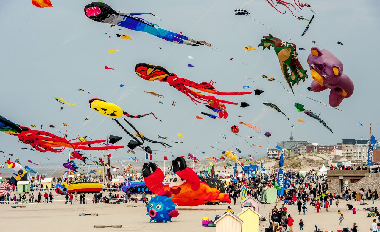 People fly kites in Berck-sur-Mer, France, during the 28th International Kite Meeting on Saturday, April 12. The event takes place through April 21.