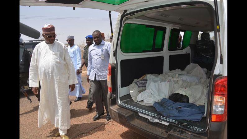 Yobe state Gov. Ibrahim Gaidam, left, looks at the bodies of students inside an ambulance outside a mosque in Damaturu. At least 29 students died in an <a href="index.php?page=&url=http%3A%2F%2Fedition.cnn.com%2F2014%2F02%2F25%2Fworld%2Fafrica%2Fnigeria-school-attack%2F">attack on a federal college </a>in Buni Yadi, near the capital of Yobe state, Nigeria's military said on February 26, 2014. Authorities suspect Boko Haram carried out the assault in which several buildings were also torched.