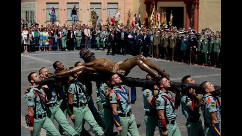 Members of the Spanish Legion carry a statue of Christ of Mena on April 17 in Malaga, Spain.