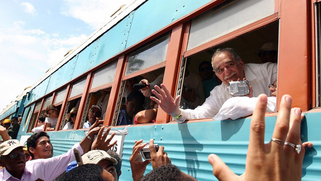 García Márquez waves out the window of a train in 2007 upon arriving in his hometown of Aracataca, Colombia.