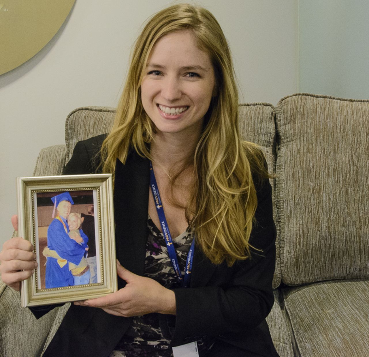 Erin Schwantner keeps the photo of her and her brother after his high school graduation on her desk at work.