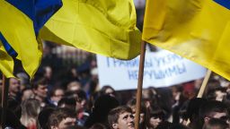 A Ukrainian student waves his national flag during a nationalist and pro-unity rally in the eastern city of Lugansk on April 17, 2014.