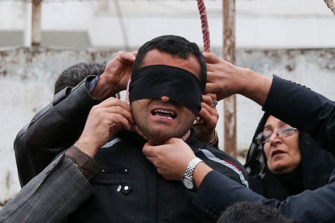 The parents of Abdollah Hosseinzadeh remove a noose from the neck of his convicted killer, a man identified only as Balal. Balal killed Hosseinzadeh during a street fight in 2007, according to the semi-official Iranian news agency ISNA. But just seconds before Balal was to be hanged in public this week, <a href="http://www.cnn.com/2014/04/17/world/meast/iran-execution-photos-mother-forgives/index.html">he was forgiven</a> by Hosseinzadeh's mother.
