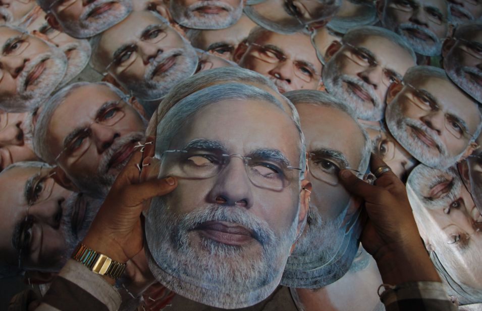 A worker arranges masks of Bharatiya Janata Party candidate Narendra Modi at a printing press in Ahmedabad, India, on Saturday, April 12.