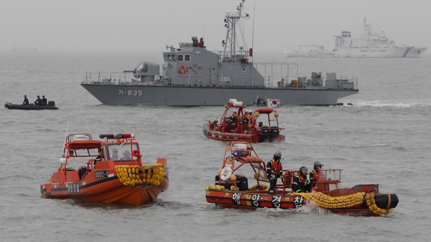 Caption:JINDO-GUN, SOUTH KOREA - APRIL 17: South Korean Coast Guard and rescue teams search for missing passengers at the site of the sunken ferry off the coast of Jindo Island on April 17, 2014 in Jindo-gun, South Korea. At least six people are reported dead, with 290 still missing. The ferry identified as the Sewol was carrying about 470 passengers, including students and teachers, traveling to Jeju Island. (Photo by Chung Sung-Jun/Getty Images)

