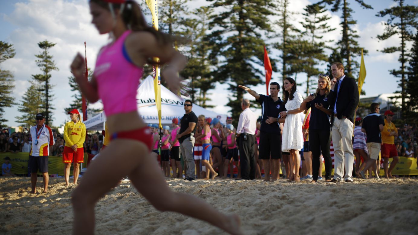 The royal couple watches a beach sprint race with Australian surf lifesavers on Manly Beach on April 18.