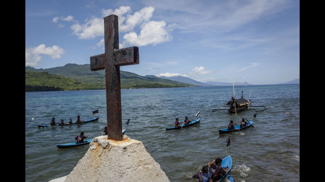 Catholic worshippers perform a sea procession to transfer a statue of Jesus Christ from one church to another April 18 in Larantuka, Indonesia.