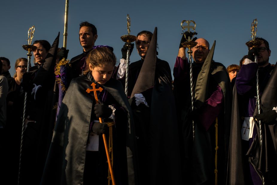 Worshippers of the Santisimo Cristo del Salvador brotherhood pray around the crucifix during a procession April 18 in Valencia, Spain. 
