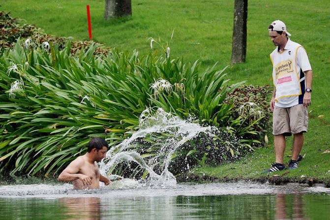 Golfer Pablo Larrazabal had to jump into a water hazard during round two of the Malaysian Open at Kuala Lumpur Golf & Country Club.