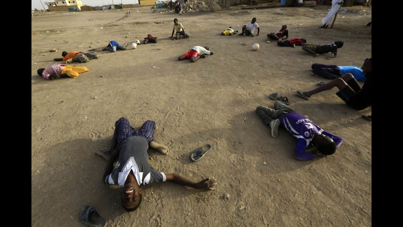 Displaced children from South Sudan gather to play soccer at a camp in Khartoum, Sudan, on Wednesday, March 12.